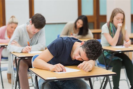 Man sleeping during exam in exam hall Stock Photo - Budget Royalty-Free & Subscription, Code: 400-06802994