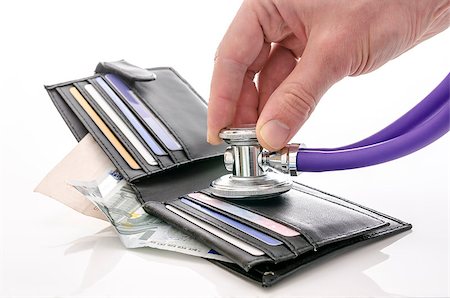 Checking open wallet with stethoscope. Concept of financial crisis. Stock Photo - Budget Royalty-Free & Subscription, Code: 400-06855811