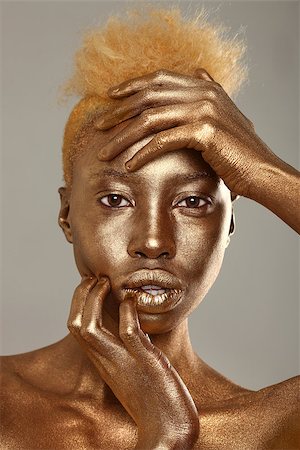 African Amercian Woman Painted With Gold Stock Photo - Budget Royalty-Free & Subscription, Code: 400-06856071