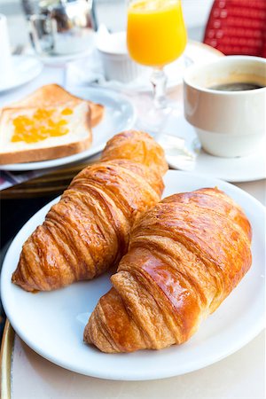simsearch:400-05704519,k - Breakfast with coffee and croissants in a basket on table Stock Photo - Budget Royalty-Free & Subscription, Code: 400-06856184