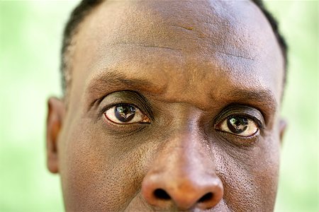 Elderly people and emotions, portrait of serious senior african american man looking at camera against green wall Stock Photo - Budget Royalty-Free & Subscription, Code: 400-06856679