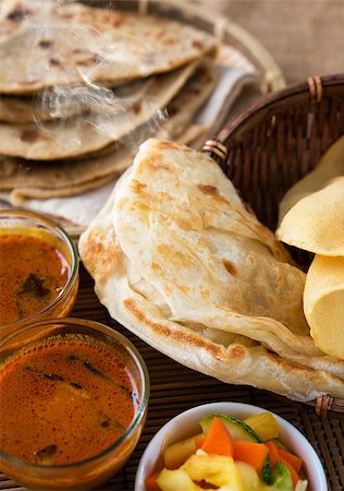 simsearch:400-07418409,k - Indian meal, Chapati flatbread, roti canai, dal, curry, teh tarik or pulled tea, acar. Famous indian food. Stock Photo - Budget Royalty-Free & Subscription, Code: 400-06858501