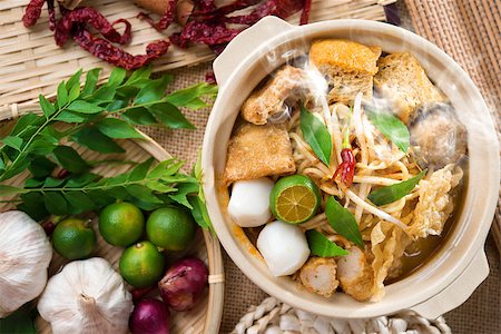 simsearch:400-07418409,k - Hot and spicy Singaporean Curry Noodle or laksa  mee with hot steam in clay pot, decoration setup, serve with chopsticks. Singapore cuisine. Stock Photo - Budget Royalty-Free & Subscription, Code: 400-06858917