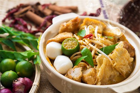 simsearch:400-07418409,k - Hot and spicy Malaysia Curry Noodle or laksa  mee with hot steam in clay pot, decoration setup, serve with chopsticks. Malaysian cuisine. Stock Photo - Budget Royalty-Free & Subscription, Code: 400-06858918