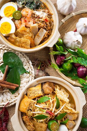 simsearch:400-07418409,k - Hot and spicy Curry Noodles or laksa  mee and prawn noodle with hot steam in clay pot, decoration setup, serve with chopsticks. Asia cuisine. Stock Photo - Budget Royalty-Free & Subscription, Code: 400-06858920