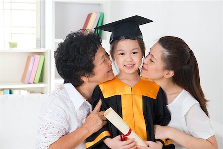 Kindergarten graduation. Asian family, grandparent and parent kissing grandchild on her kinder graduate day. Stock Photo - Budget Royalty-Free & Subscription, Code: 400-06858938