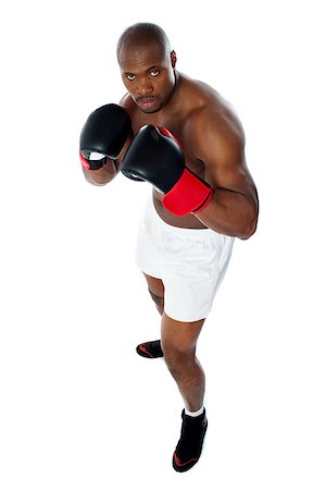 simsearch:400-06482604,k - Black african boxer ready to fight. Giving serious look towards camera Stock Photo - Budget Royalty-Free & Subscription, Code: 400-06859131