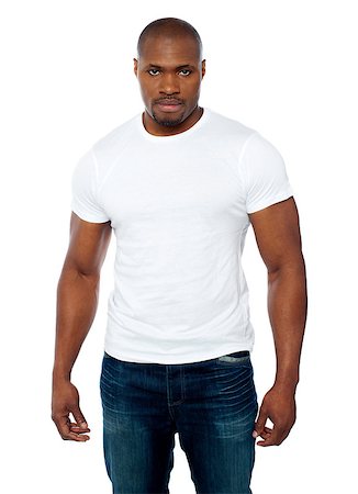 simsearch:400-06859193,k - Casual muscular african young man looking right into camera against white background Stock Photo - Budget Royalty-Free & Subscription, Code: 400-06859176