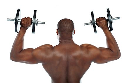 simsearch:400-06859193,k - Rear view of a young male bodybuilder doing heavy weight exercise with dumbbells Stock Photo - Budget Royalty-Free & Subscription, Code: 400-06859186