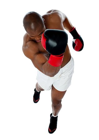 simsearch:400-06859193,k - A black african american man athletic boxer with boxing gloves punching in upwards direction Stock Photo - Budget Royalty-Free & Subscription, Code: 400-06859197