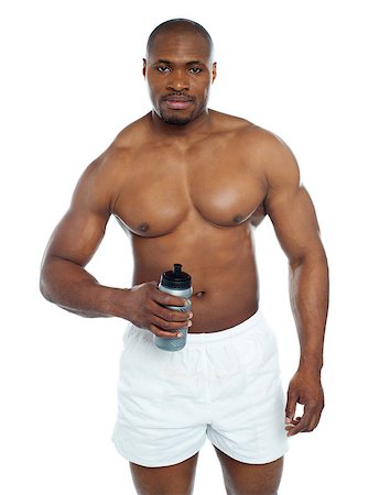simsearch:400-06482604,k - Athlete posing with health drink bottle isolated over white Stock Photo - Budget Royalty-Free & Subscription, Code: 400-06859191
