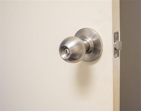 simsearch:400-04617631,k - The white door with metal doorknob is regular lock style in modern house Stock Photo - Budget Royalty-Free & Subscription, Code: 400-06859657