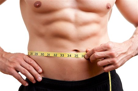 simsearch:400-06480033,k - Fit man measuring his waist after a workout in the gym, isolated in a white background Foto de stock - Super Valor sin royalties y Suscripción, Código: 400-06853620