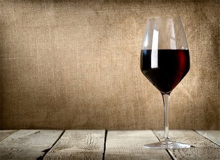 Red wine glass on the wooden table Stock Photo - Budget Royalty-Free & Subscription, Code: 400-06853818