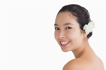 fresh-faced - Black haired woman wearing a flower in her hair while being naked Stock Photo - Budget Royalty-Free & Subscription, Code: 400-06864586