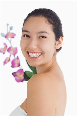 fresh-faced - Smiling natural beauty with orchids Stock Photo - Budget Royalty-Free & Subscription, Code: 400-06864607