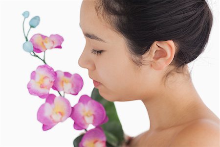 fresh-faced - Female beauty smelling on orchids Stock Photo - Budget Royalty-Free & Subscription, Code: 400-06864610