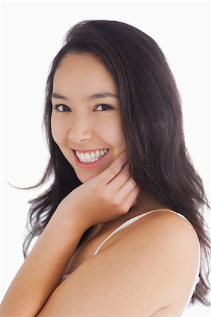fresh-faced - Female beauty smiling while touching her skin Stock Photo - Budget Royalty-Free & Subscription, Code: 400-06864612
