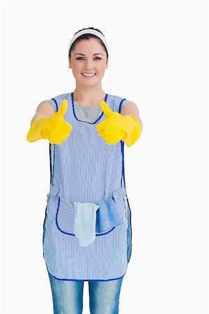 Cleaning woman giving thumbs up with yellow gloves on white background Stock Photo - Budget Royalty-Free & Subscription, Code: 400-06866016