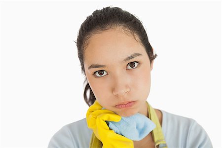 simsearch:400-06863660,k - Weary woman holding cleaning rag in apron and rubber gloves Stock Photo - Budget Royalty-Free & Subscription, Code: 400-06866417