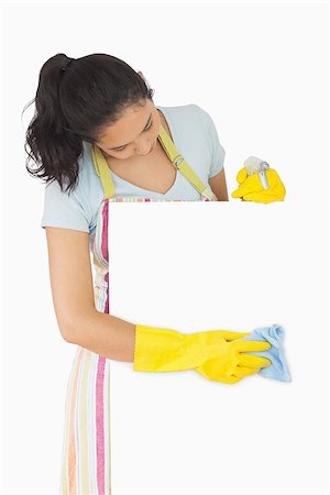 simsearch:400-06863660,k - Smiling woman in striped apron wiping white surface with blue rag Stock Photo - Budget Royalty-Free & Subscription, Code: 400-06866435