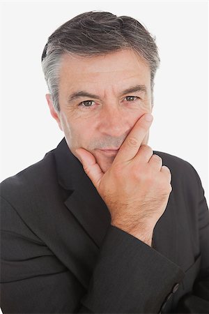 simsearch:400-04283915,k - Portrait of serious thoughtful businessman with hand on chin over white background Stock Photo - Budget Royalty-Free & Subscription, Code: 400-06868641