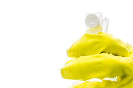 simsearch:400-08693600,k - Hand in a yellow rubber glove holding a spray bottle towards you. With copy space. Stock Photo - Budget Royalty-Free & Subscription, Code: 400-06860361