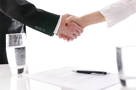 pact - Business man and woman shaking hands after signing a contract. Isolated over white background. Stock Photo - Budget Royalty-Free & Subscription, Code: 400-06860394