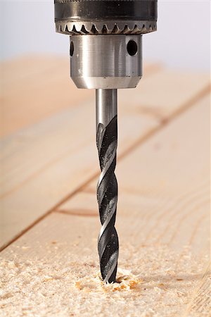 drilling (activity) - Wood drill bit and head closeup Foto de stock - Super Valor sin royalties y Suscripción, Código: 400-06860454