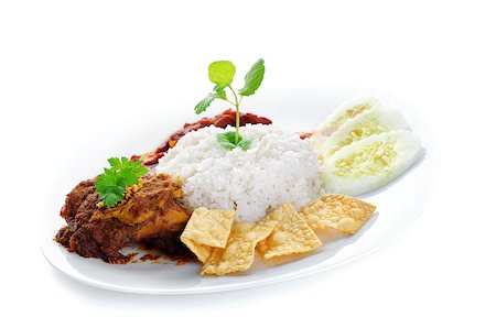 simsearch:400-07418409,k - Nasi lemak traditional malaysia spicy rice dish. Served with belacan, ikan bilis, acar, peanuts and cucumber. Malaysian food. Asian cuisine. Stock Photo - Budget Royalty-Free & Subscription, Code: 400-06860618