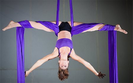 Beautiful woman gymnast performing aerial exercises Stock Photo - Budget Royalty-Free & Subscription, Code: 400-06861782
