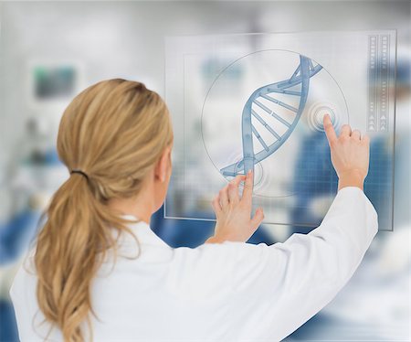 dna helix - Woman using DNA helix interface hologram Stock Photo - Budget Royalty-Free & Subscription, Code: 400-06862453