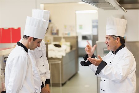 Upset head chef scolding employees in the kitchen Stock Photo - Budget Royalty-Free & Subscription, Code: 400-06863200