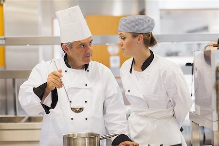 Student and teacher discussing the soup in kitchen Stock Photo - Budget Royalty-Free & Subscription, Code: 400-06863280