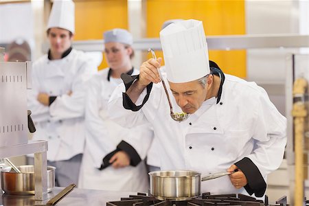 Chef tasting his students work in kitchen Stock Photo - Budget Royalty-Free & Subscription, Code: 400-06863292