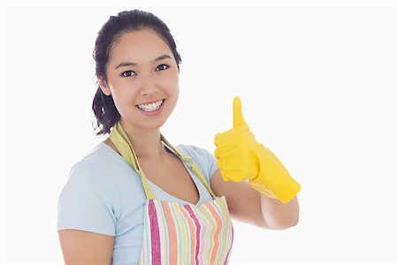 simsearch:400-06863660,k - Happy woman giving thumbs up in yellow rubber gloves and apron Stock Photo - Budget Royalty-Free & Subscription, Code: 400-06863555