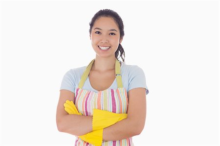 simsearch:400-06863660,k - Smiling woman standing with arms crossed wearing apron and rubber gloves Stock Photo - Budget Royalty-Free & Subscription, Code: 400-06863551