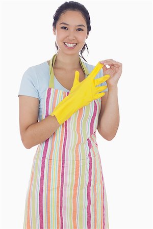 simsearch:400-06863660,k - Smiling woman in apron taking off rubber gloves Stock Photo - Budget Royalty-Free & Subscription, Code: 400-06863561