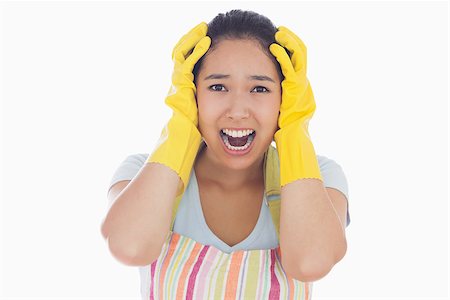 simsearch:400-06863660,k - Distressed woman with hands on her head wearing apron and rubber gloves and screaming Stock Photo - Budget Royalty-Free & Subscription, Code: 400-06863562