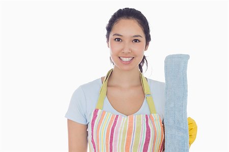 simsearch:400-06863660,k - Smiling woman holding dust mop and wearing apron Stock Photo - Budget Royalty-Free & Subscription, Code: 400-06863574