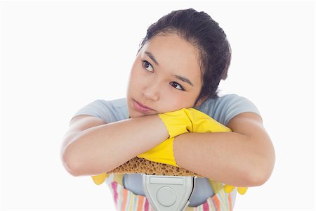 simsearch:400-06863660,k - Troubled woman leaning on a mop in her apron Stock Photo - Budget Royalty-Free & Subscription, Code: 400-06863577