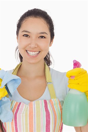 simsearch:400-06863660,k - Hapyp woman in apron holdig spray bottle and rag Stock Photo - Budget Royalty-Free & Subscription, Code: 400-06863605
