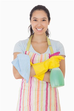 simsearch:400-06863660,k - Woman standing with hands crossed holding cleaning products and smiling Stock Photo - Budget Royalty-Free & Subscription, Code: 400-06863606