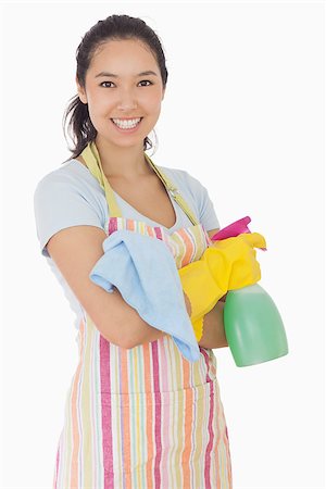 simsearch:400-06863660,k - Happy woman holding spray bottle and rag in apron and rubber gloves Stock Photo - Budget Royalty-Free & Subscription, Code: 400-06863608