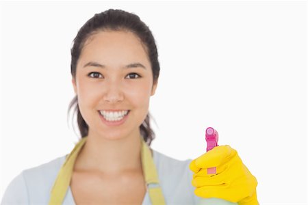 simsearch:400-06863660,k - Smiling woman in rubber gloves with spray bottle Stock Photo - Budget Royalty-Free & Subscription, Code: 400-06863603