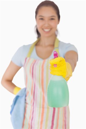 simsearch:400-06863660,k - Young woman using a window cleaner Stock Photo - Budget Royalty-Free & Subscription, Code: 400-06863616