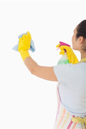 simsearch:400-06863660,k - Woman cleaning wall with cloth and spray bottle Stock Photo - Budget Royalty-Free & Subscription, Code: 400-06863638