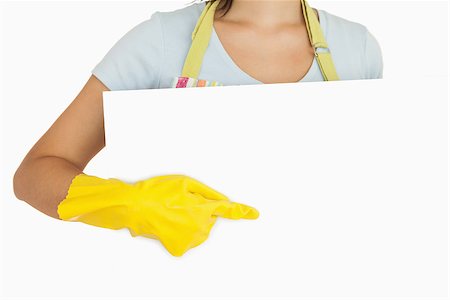 simsearch:400-06863660,k - Female hand in yellow glove pointing to white board Stock Photo - Budget Royalty-Free & Subscription, Code: 400-06863678