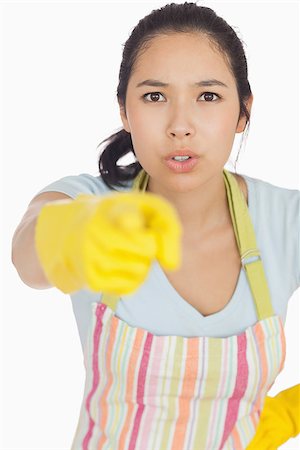 simsearch:400-06863660,k - Accusing woman in apron and rubber gloves pointing ahead Stock Photo - Budget Royalty-Free & Subscription, Code: 400-06863687