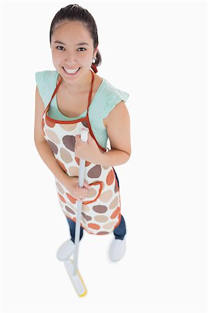 Happy woman sweeping the floor on a white background Stock Photo - Budget Royalty-Free & Subscription, Code: 400-06863966